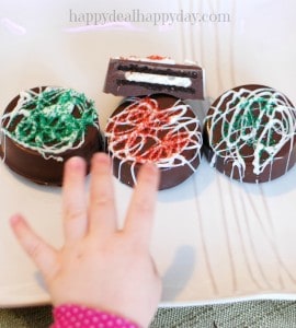 Chocolate Covered Oreos - Christmas Version! Here is a great step-by-step tutorial to make these beautiful and rich cookies! They look much more difficult to make than they are - very easy to do and make a great gift!!!! toddler photo bomb!