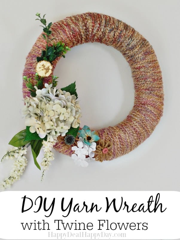 DIY Yarn Wreath with Twine Flowers: here is an easy tutorial showing you how to make a yarn wreath, and decorate it with some cute twine flowers and other fake or burlap flowers! happydealhappyday.com