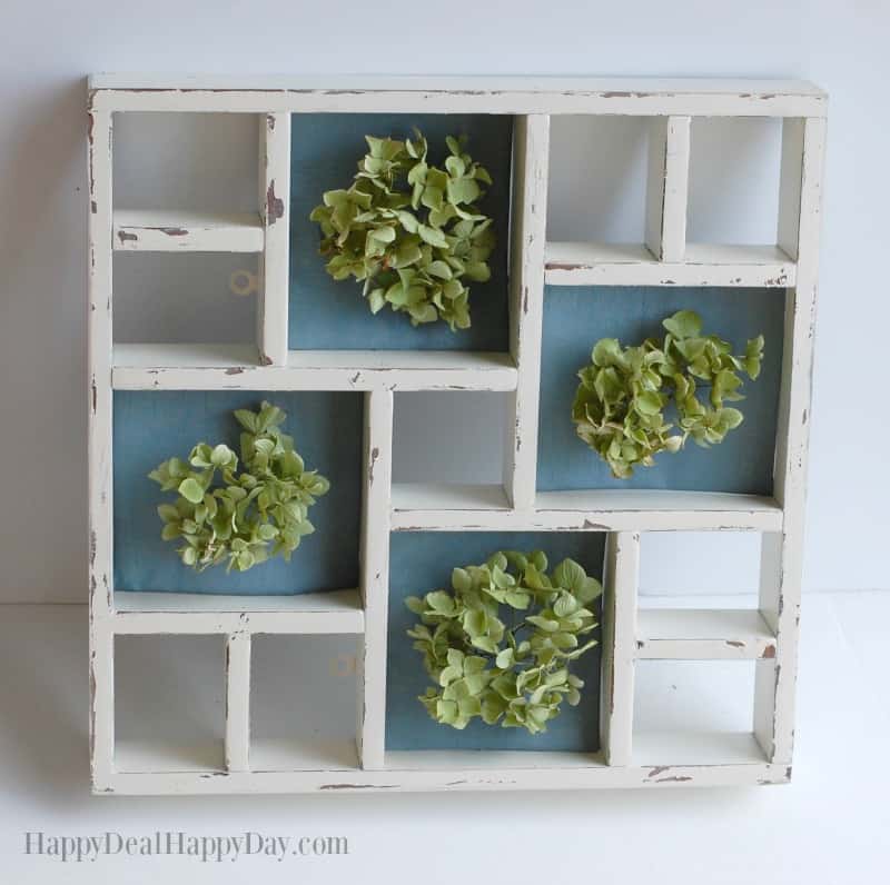 Shabby Chic Display Shelf Makeover - give an old knick knack shelf new life with this makeover! I show you how to distress the wood, and work with dried hydrangeas for this one of a kind wall hanging. GO HERE to see the tutorial: http://wp.me/pUbK5-vl5
