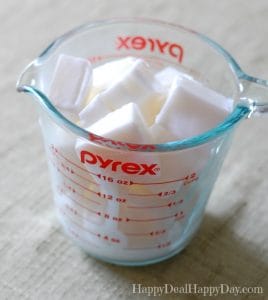 Soap base cut into chunks in pyrex glass measuring cup