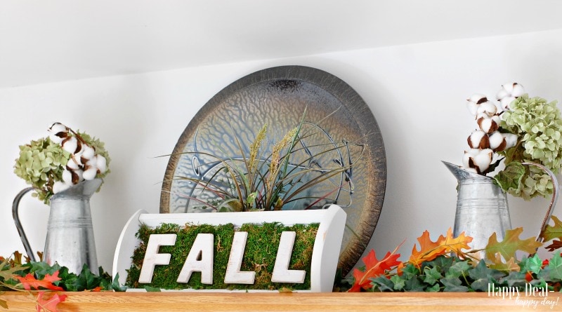 upcycled fall decor using an old CD holder.