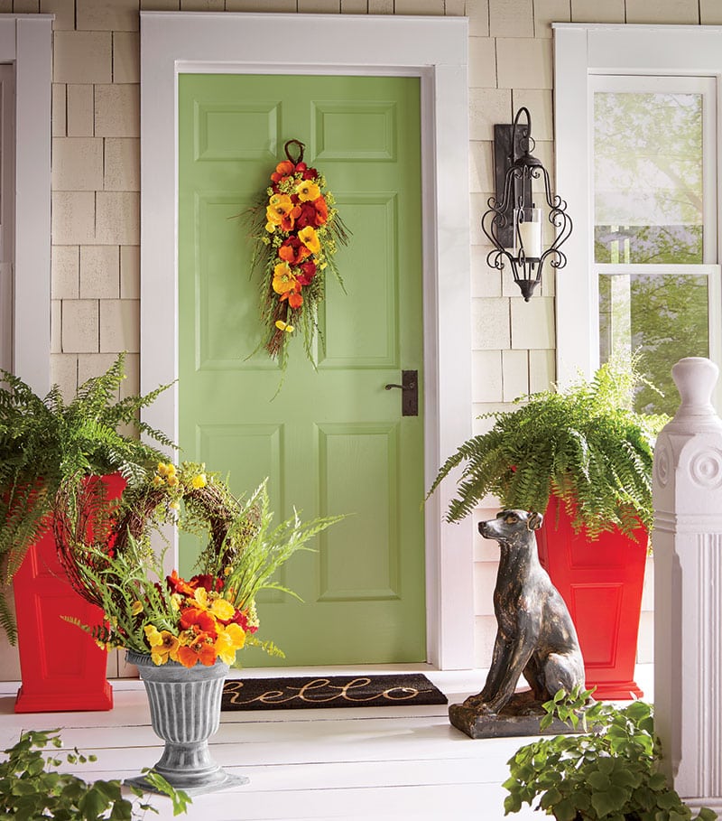 Colorful floral swag on green door