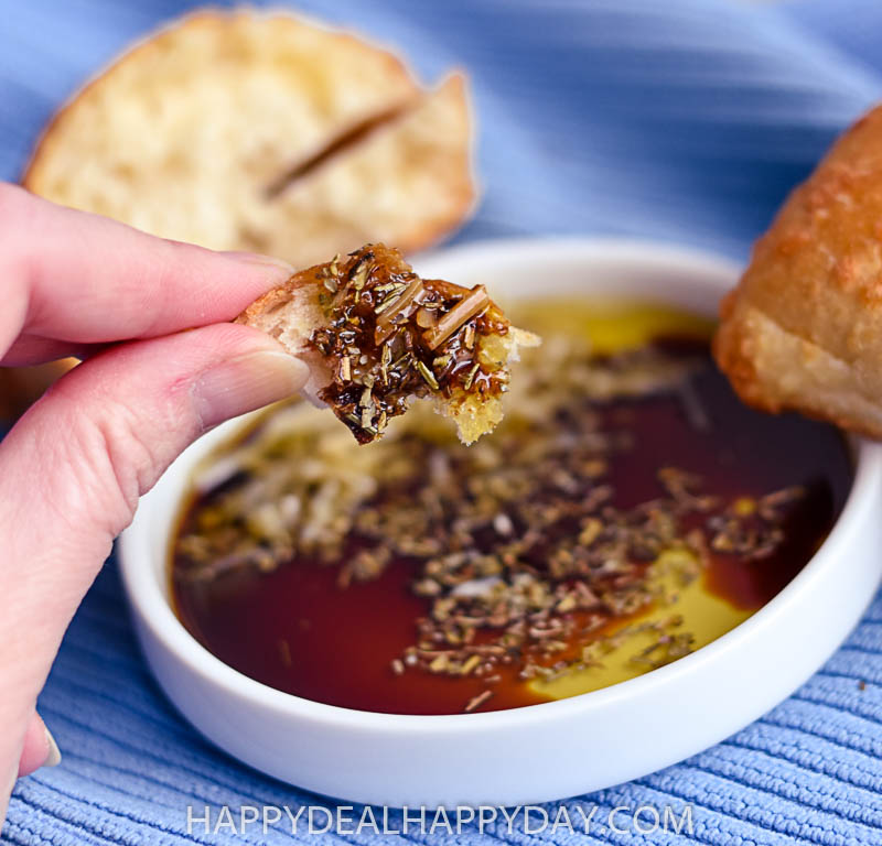 olive oil bread dip with balsamic vinegar, seasoning, and Parmesan cheese