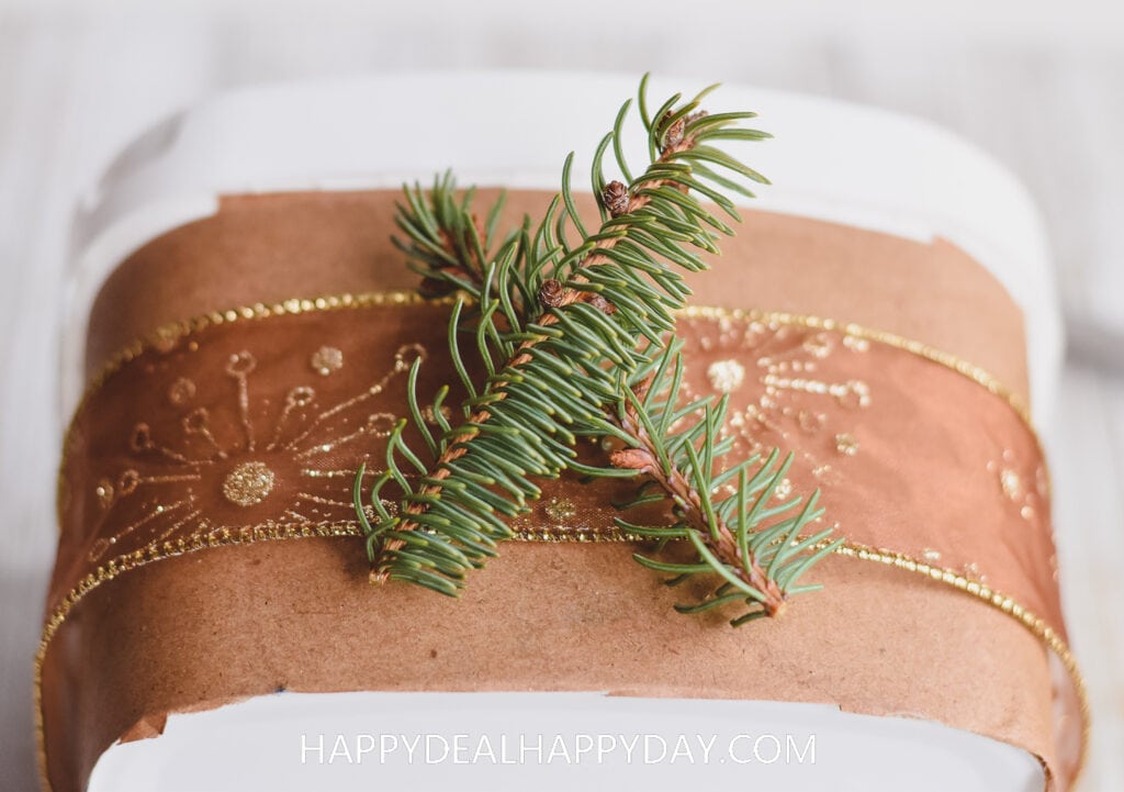 how to upcycle an Oxiclean tub into Christmas Gift wrapping idea