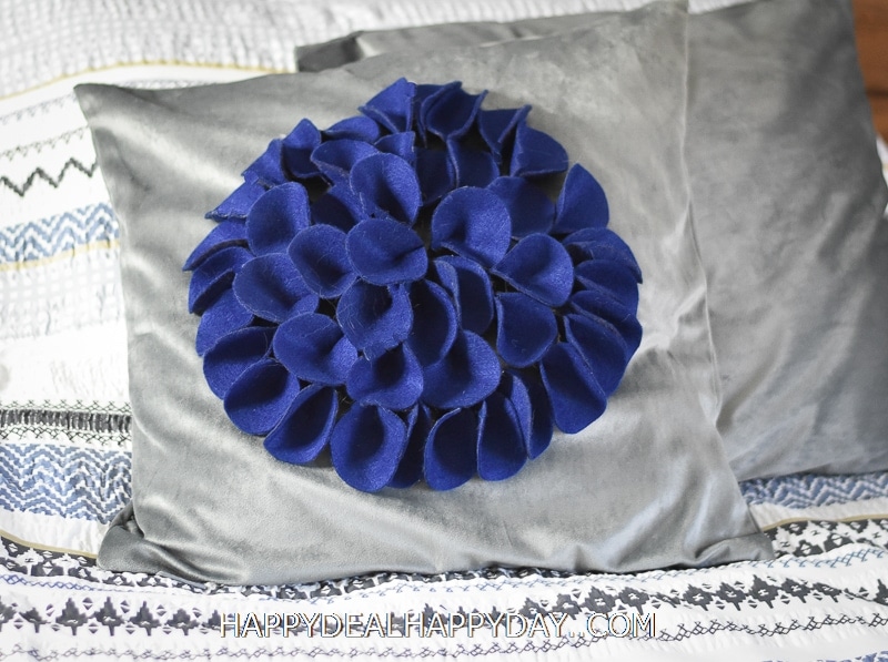 throw pillow with felt flower on top