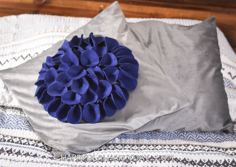 throw pillow with felt flower on top