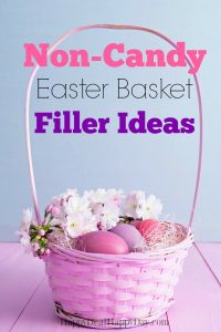 Pink Easter basket with pastel eggs and white flowers on a lilac surface. Text reads "Non-Candy Easter Basket Filler Ideas." The tone is festive and creative.